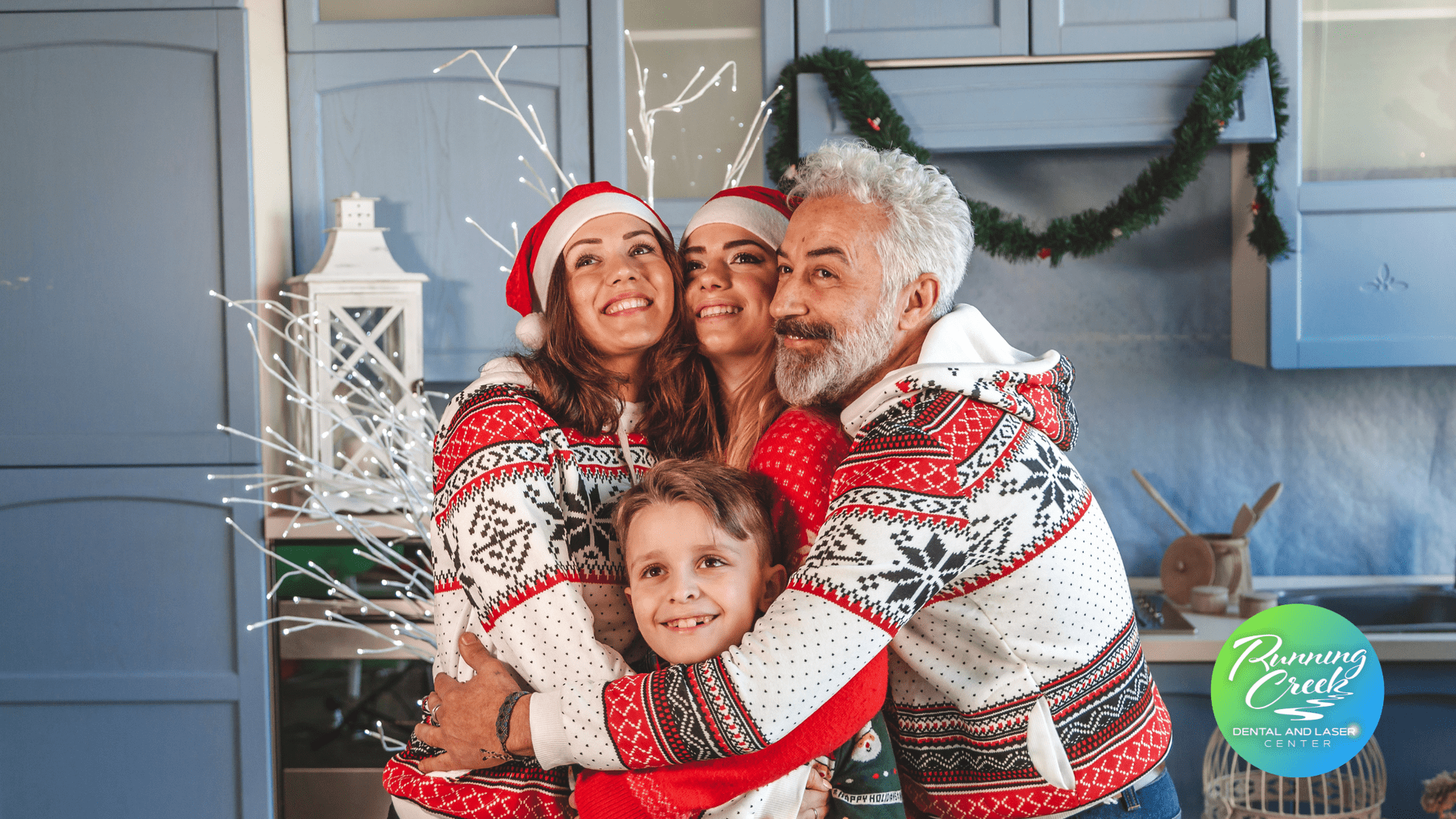 A family is posing for a picture in matching christmas sweaters.